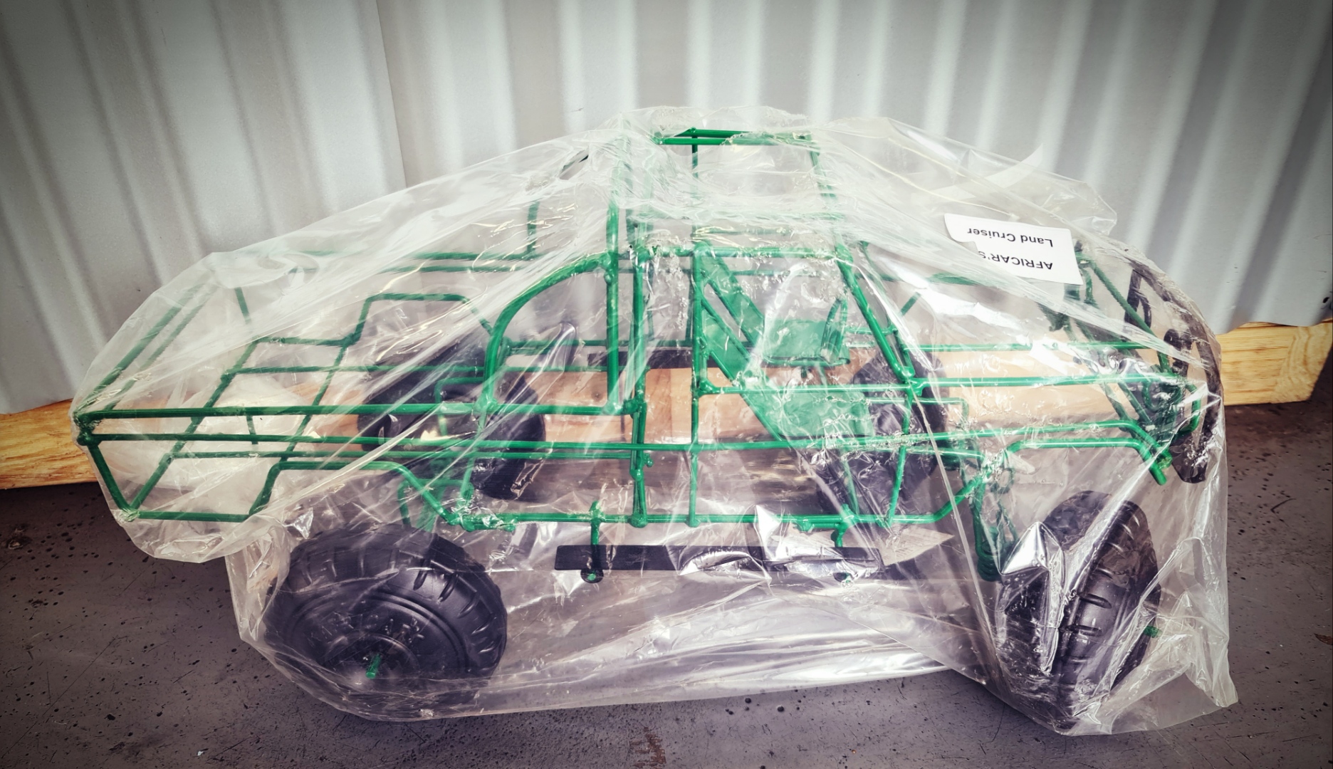 Africars For Keeps Green Open Land Cruiser and Wire Steering Wheel